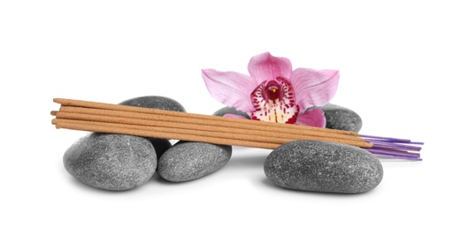 Aromatic incense sticks, spa stones and orchid flower on white background Photo of Aromatic incense sticks, spa stones and orchid flower on white background