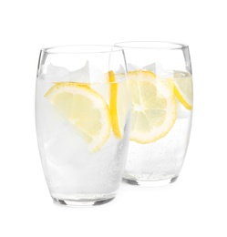 Soda water with lemon slices and ice cubes on white background Photo of Soda water with lemon slices and ice cubes on white background