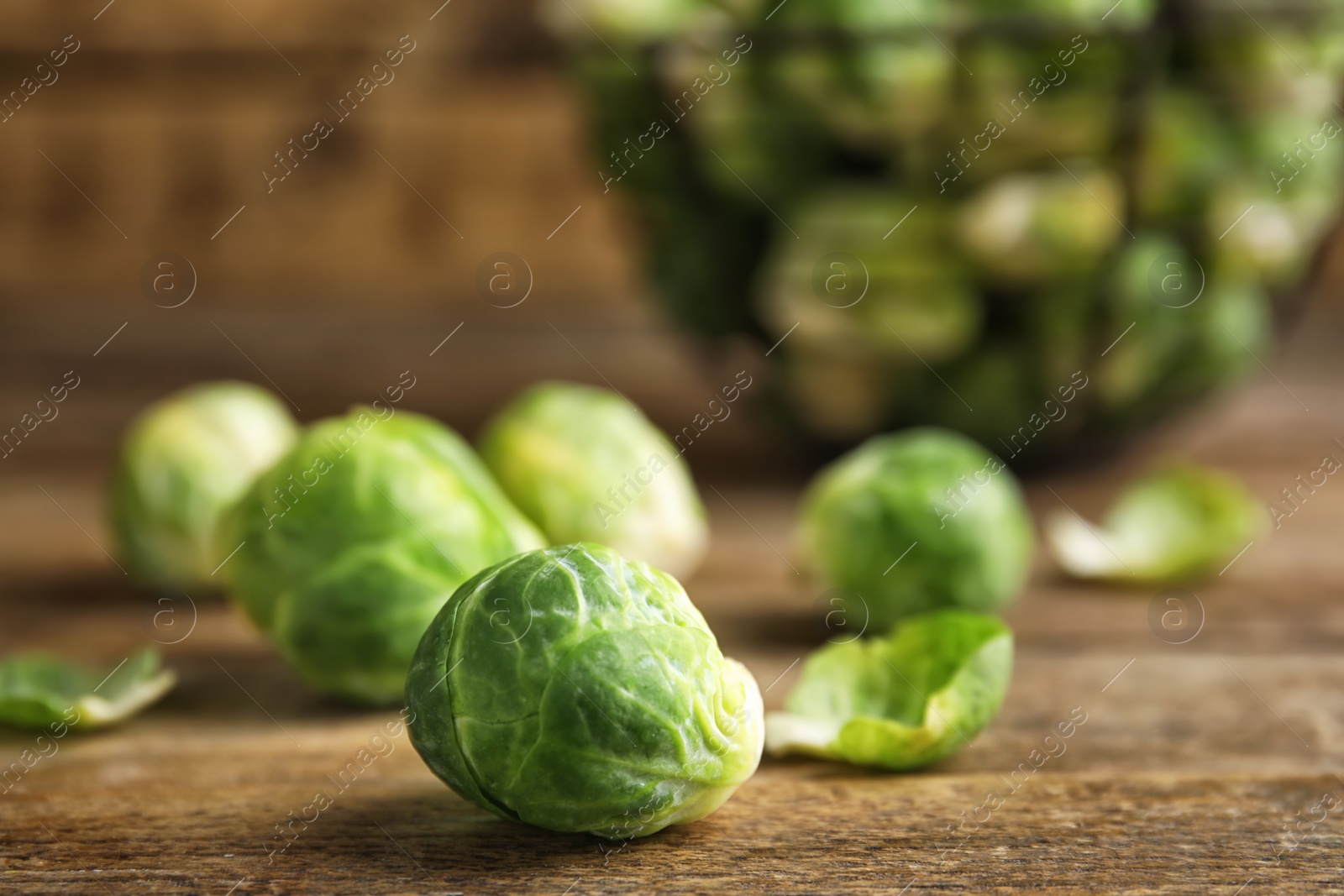 Fresh Brussels sprouts on wooden table, closeup Photo of Fresh Brussels sprouts on wooden table, closeup
