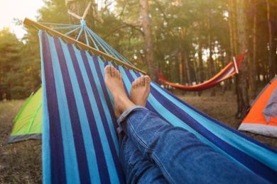 Woman resting in comfortable hammock outdoors, closeup Photo of Woman resting in comfortable hammock outdoors, closeup