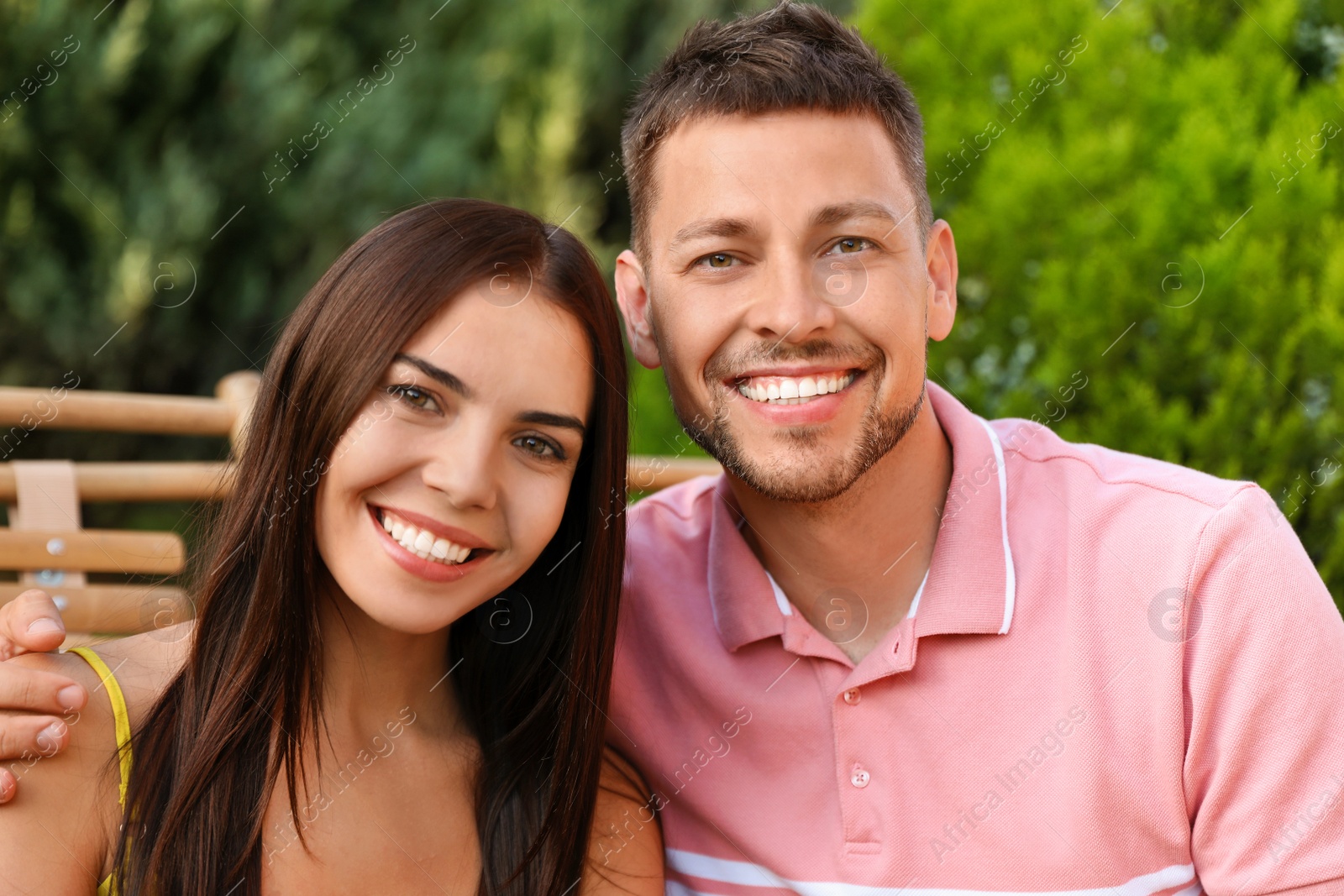 Portrait of happy couple resting together outdoors Image of Portrait of happy couple resting together outdoors