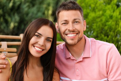 Portrait of happy couple resting together outdoors Image of Portrait of happy couple resting together outdoors