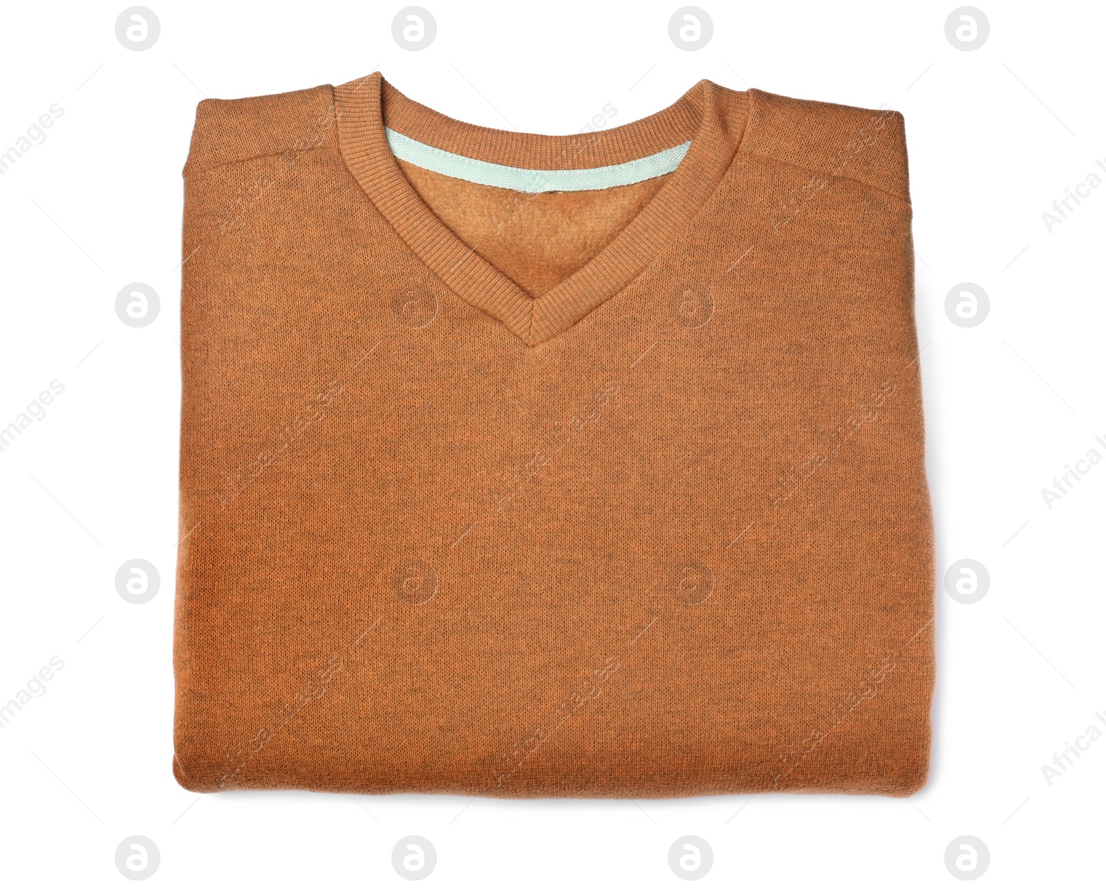 Folded cozy sweater isolated on white, top view Photo of Folded cozy sweater isolated on white, top view