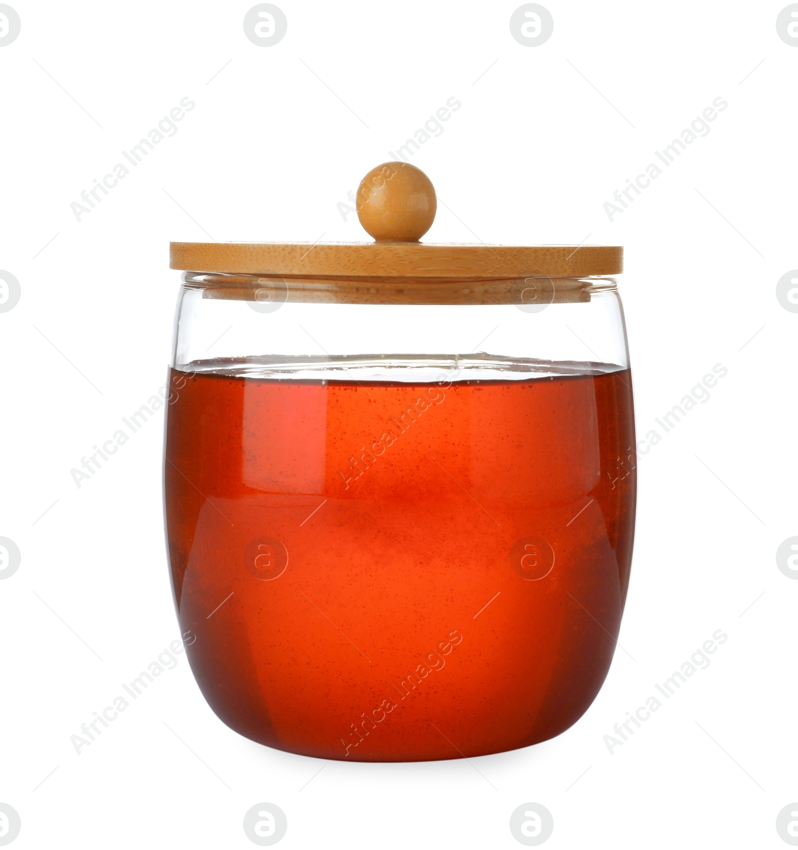 Jar with organic honey isolated on white Photo of Jar with organic honey isolated on white