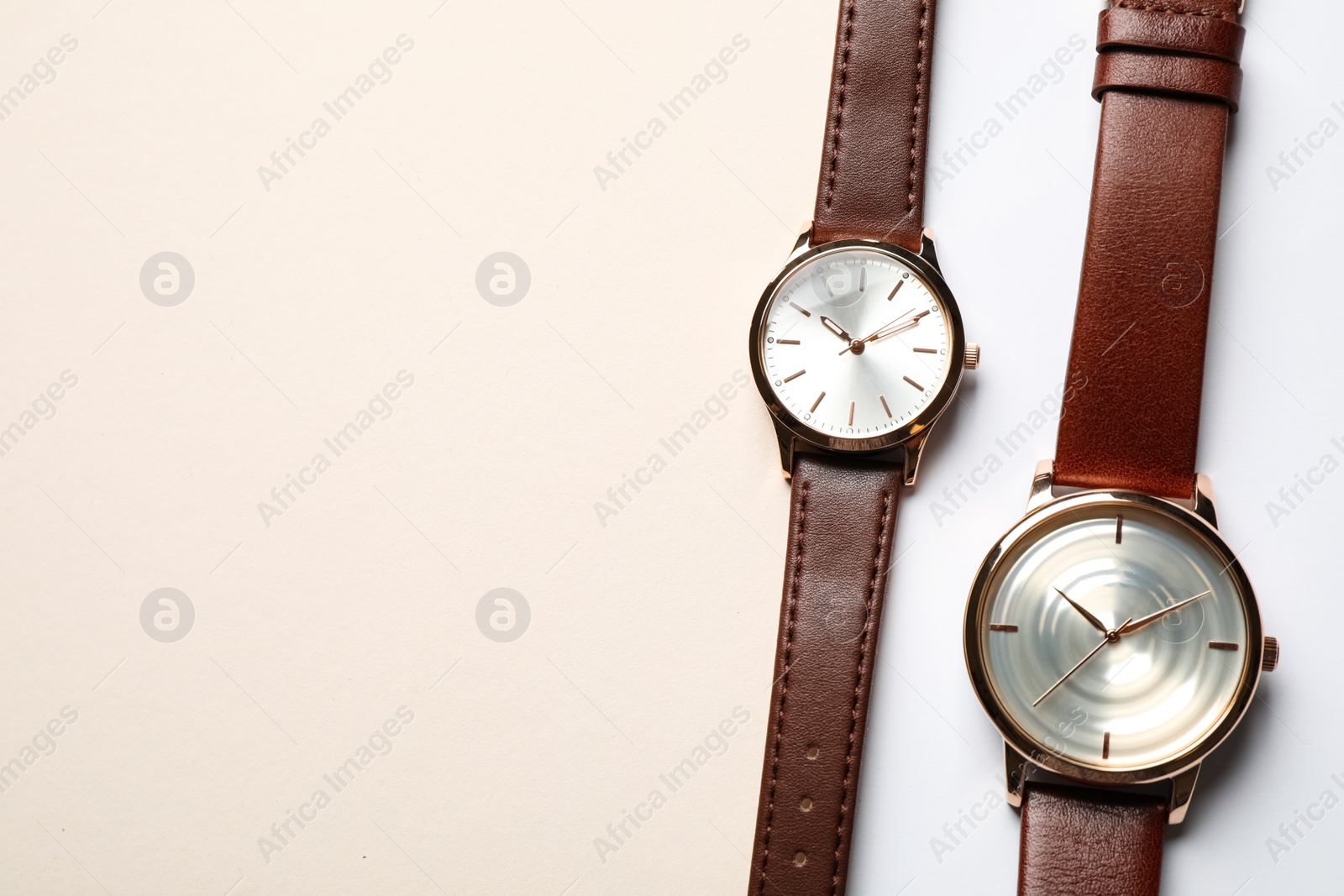 Luxury wrist watches on color background, flat lay. Space for text Photo of Luxury wrist watches on color background, flat lay. Space for text
