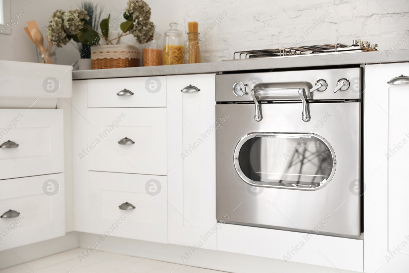 New modern oven in stylish kitchen. Cooking appliance Photo of New modern oven in stylish kitchen. Cooking appliance