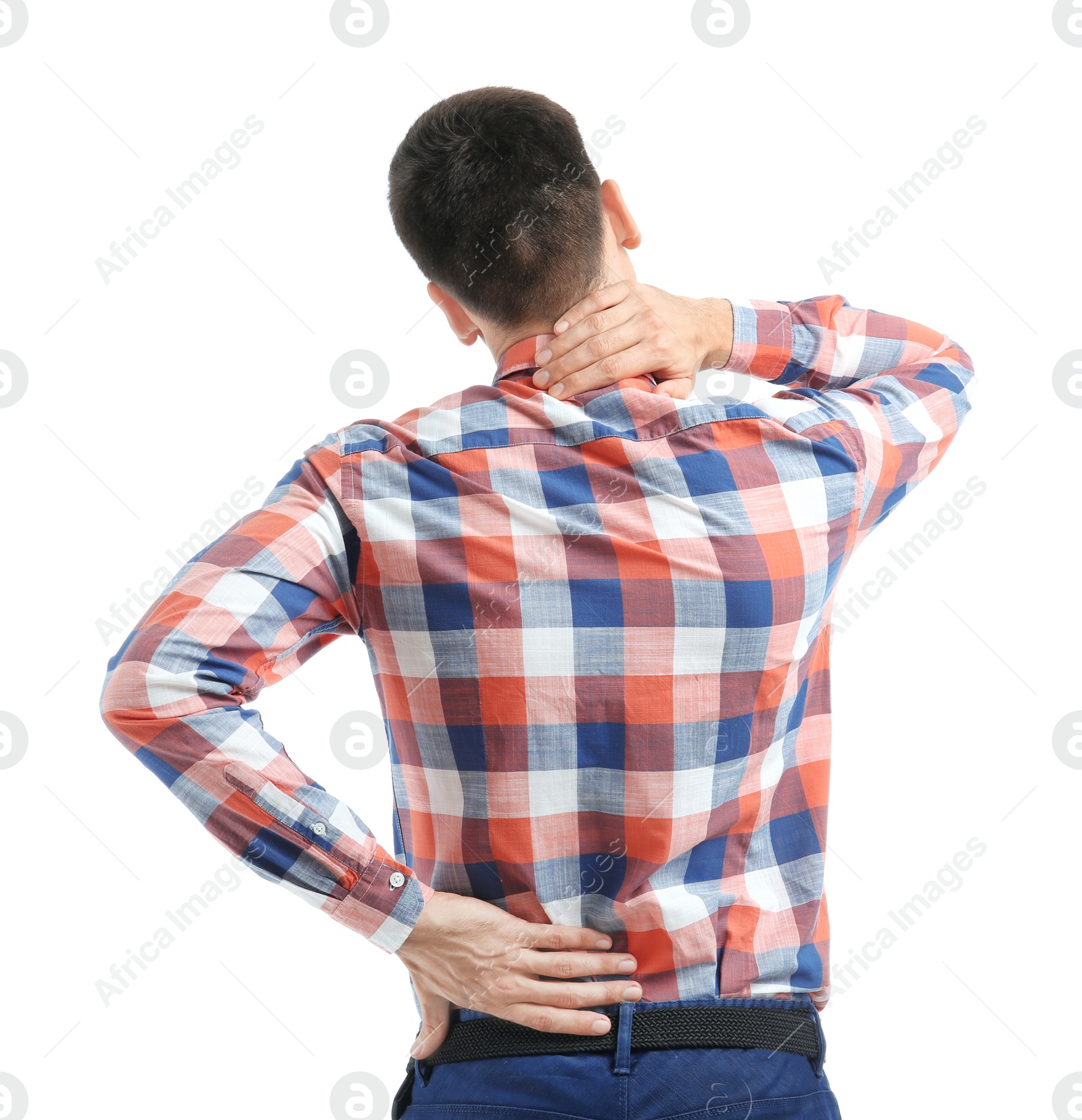 Young man suffering from back pain on white background Photo of Young man suffering from back pain on white background