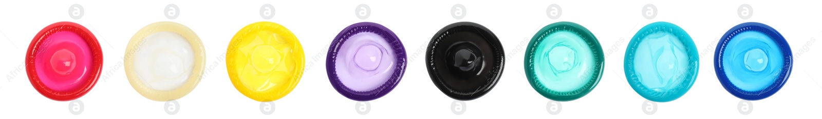 Set with different unpacked condoms on white background, top view. Banner design Image of Set with different unpacked condoms on white background, top view. Banner design