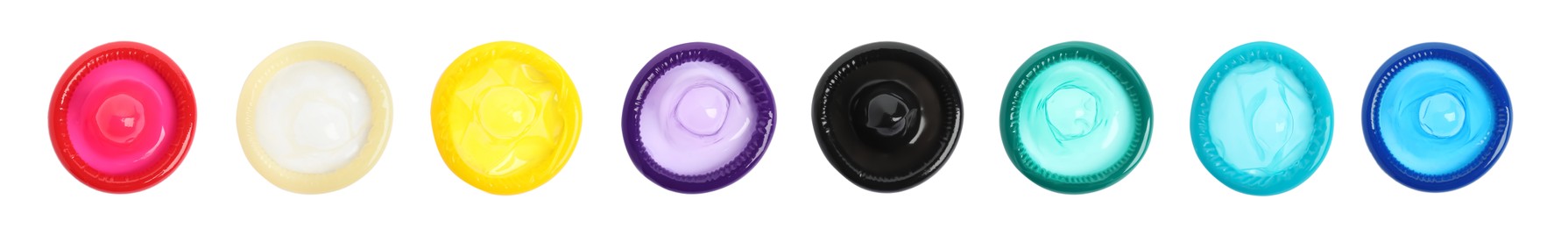 Set with different unpacked condoms on white background, top view. Banner design Image of Set with different unpacked condoms on white background, top view. Banner design