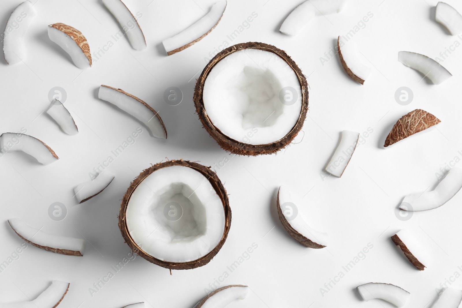 Ripe coconuts on white background, top view Photo of Ripe coconuts on white background, top view