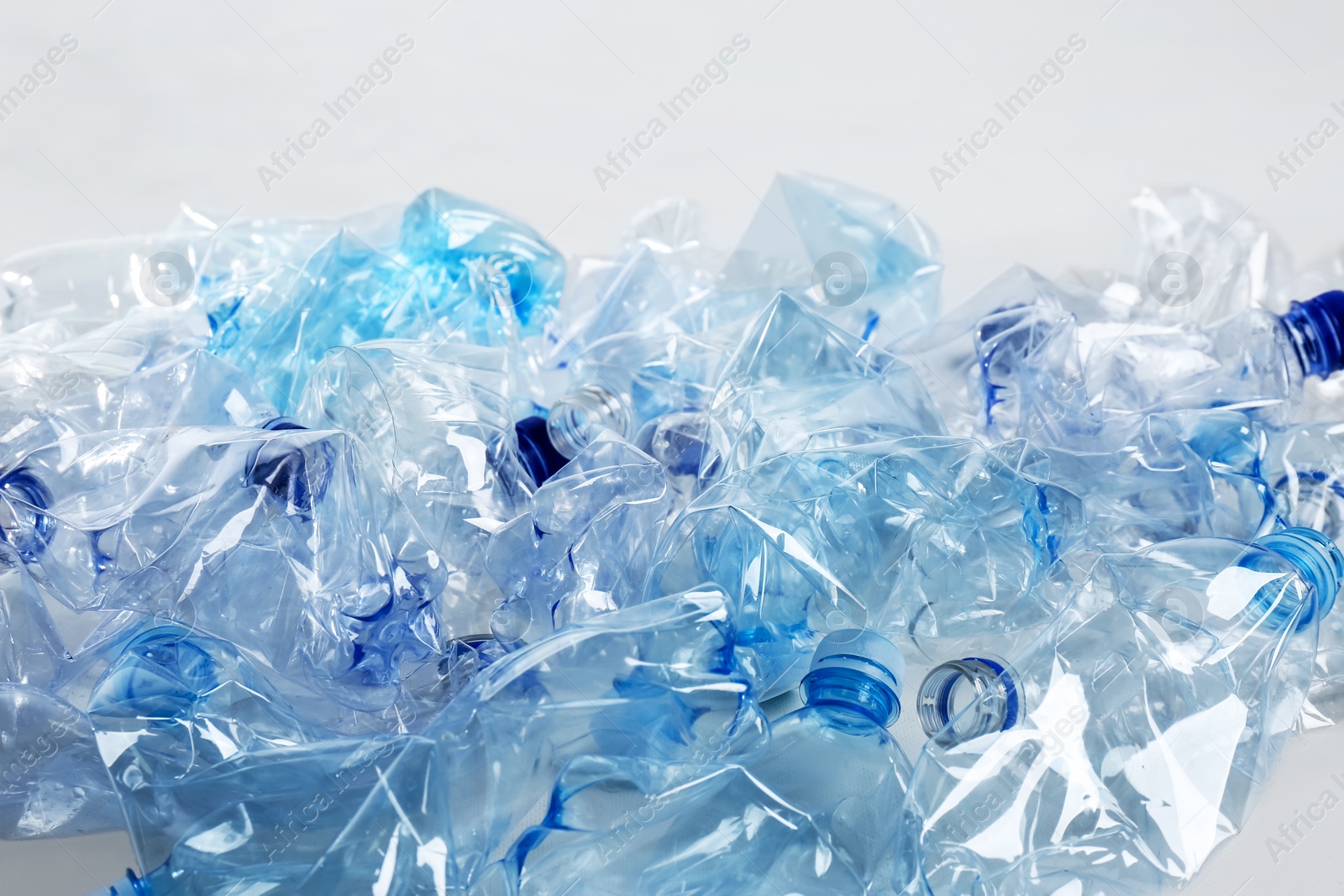 Heap of used plastic bottles on white background. Recycling problem Photo of Heap of used plastic bottles on white background. Recycling problem