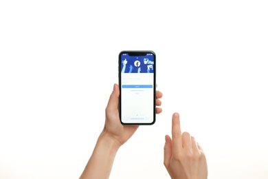 MYKOLAIV, UKRAINE - JULY 9, 2020: Woman holding iPhone X with Facebook app on white background, closeup Photo of MYKOLAIV, UKRAINE - JULY 9, 2020: Woman holding iPhone X with Facebook app on white background, closeup
