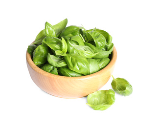 Photo of Fresh green basil leaves in wooden bowl isolated on white
