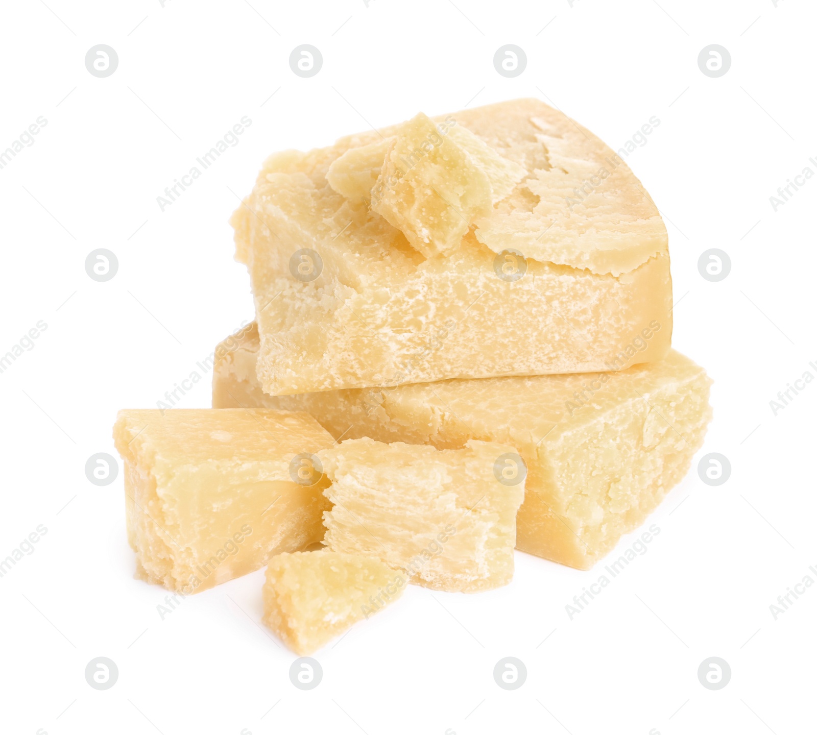 Pieces of delicious parmesan cheese on white background Photo of Pieces of delicious parmesan cheese on white background