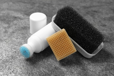 Composition with shoe care accessories on grey background, closeup Photo of Composition with shoe care accessories on grey background, closeup
