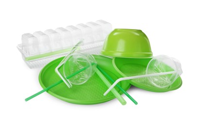 Pile of different plastic items on white background Photo of Pile of different plastic items on white background