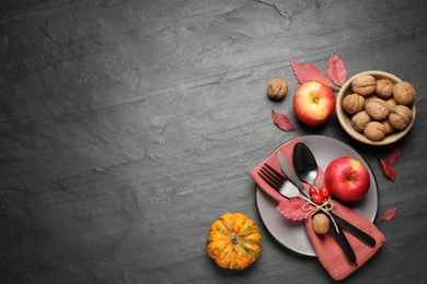 Festive table setting on black background, flat lay with space for text. Thanksgiving Day celebration Photo of Festive table setting on black background, flat lay with space for text. Thanksgiving Day celebration
