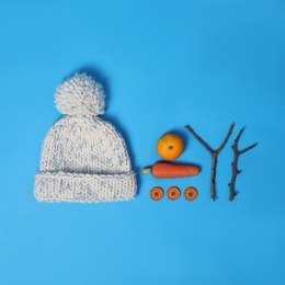 Set of materials for snowman on light blue background, flat lay Photo of Set of materials for snowman on light blue background, flat lay