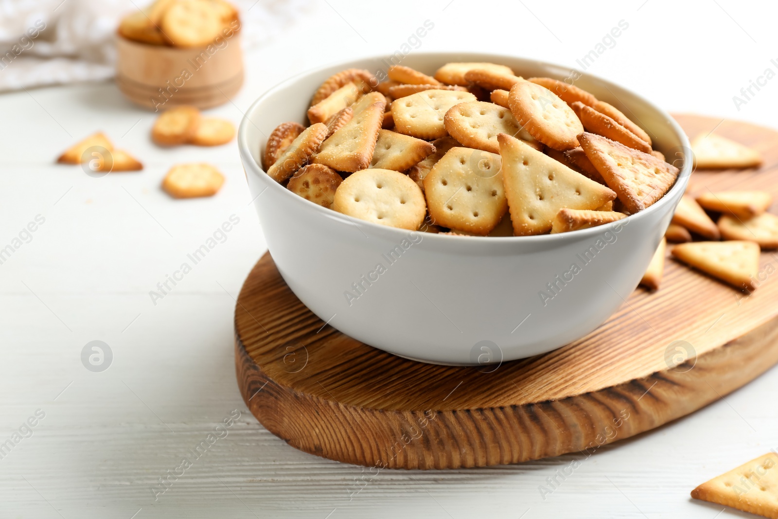 Delicious crispy crackers on white table, closeup Photo of Delicious crispy crackers on white table, closeup
