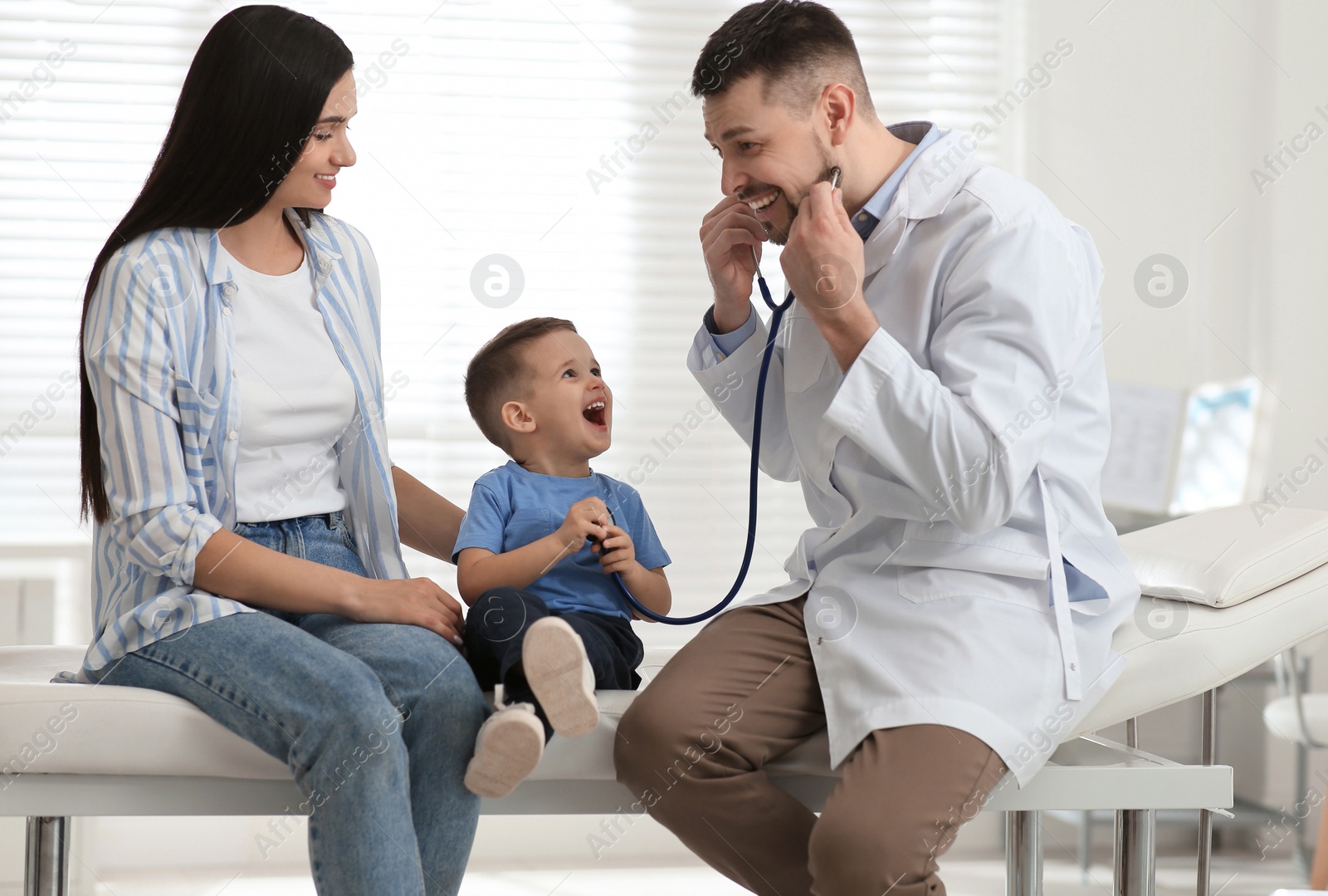 Mother and son visiting pediatrician in hospital Photo of Mother and son visiting pediatrician in hospital