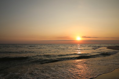 Beautiful view of sky over sea at sunset Photo of Beautiful view of sky over sea at sunset
