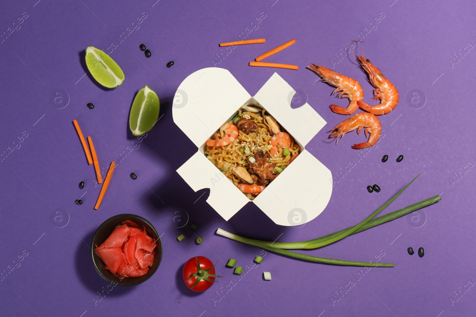 Flat lay composition with noodle wok and ingredients on purple background Photo of Flat lay composition with noodle wok and ingredients on purple background