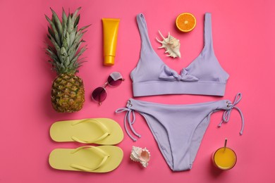 Flat lay composition with beach objects on pink background Photo of Flat lay composition with beach objects on pink background