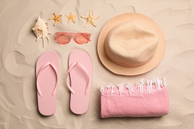 Flat lay composition with beach objects on sand Photo of Flat lay composition with beach objects on sand