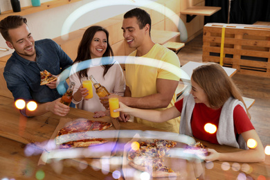 Image of Group of friends having fun party with delicious pizza in cafe, bokeh effect