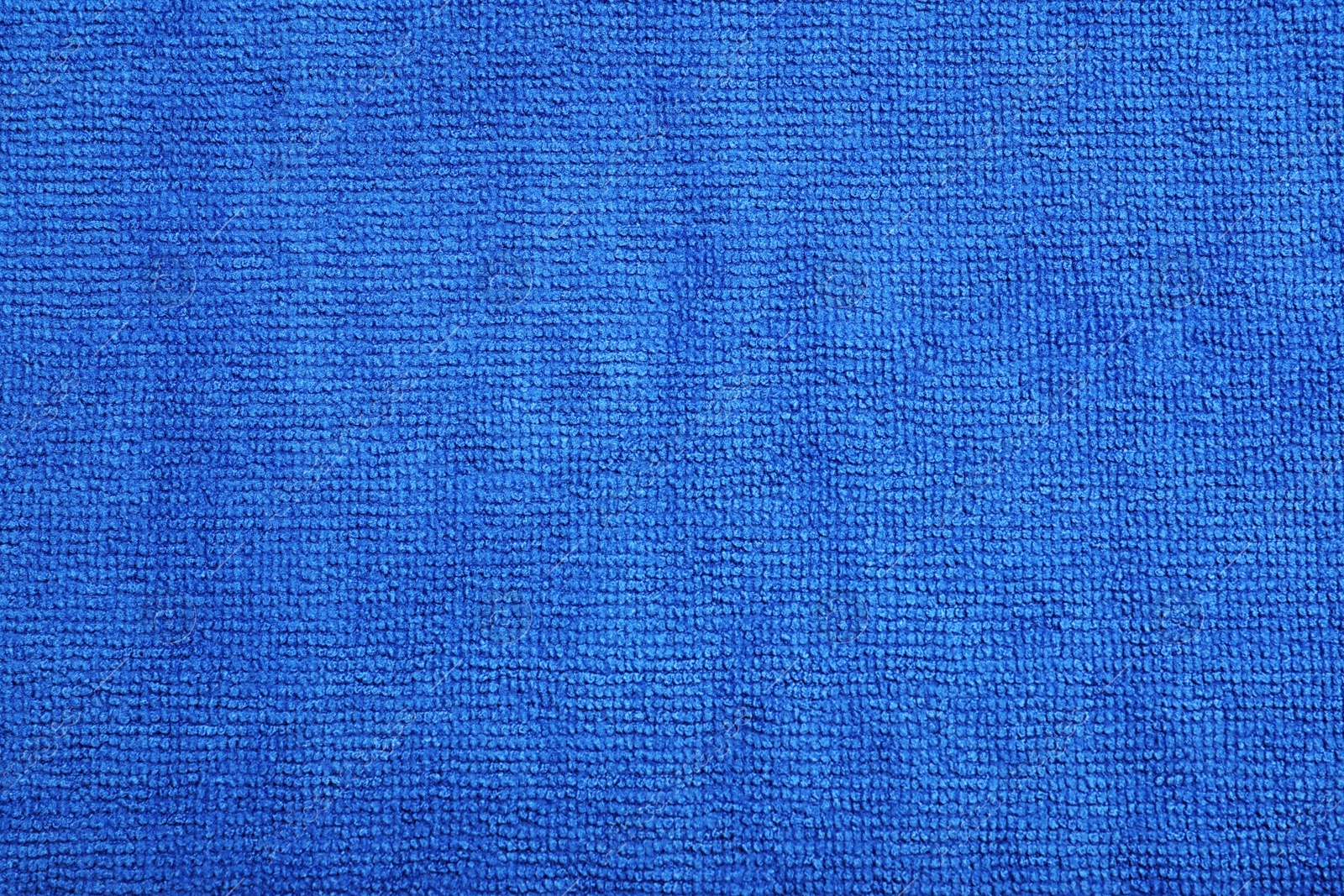Blue microfiber cloth as background, top view Photo of Blue microfiber cloth as background, top view
