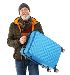 Mature man with suitcase on white background. Ready for winter vacation Photo of Mature man with suitcase on white background. Ready for winter vacation