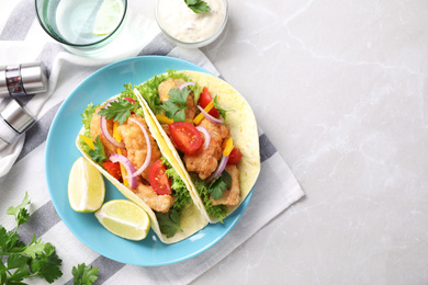 Yummy fish tacos served on marble table, flat lay. Space for text Photo of Yummy fish tacos served on marble table, flat lay. Space for text