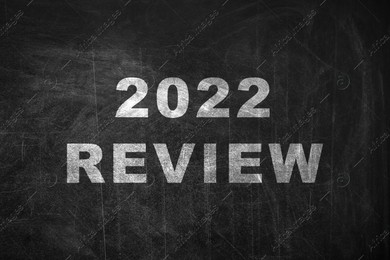 Text 2022 Review written on black chalkboard Illustration of Text 2022 Review written on black chalkboard