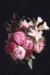 Beautiful bouquet of different flowers on black background. Floral card design with dark vintage effect Photo of Beautiful bouquet of different flowers on black background. Floral card design with dark vintage effect