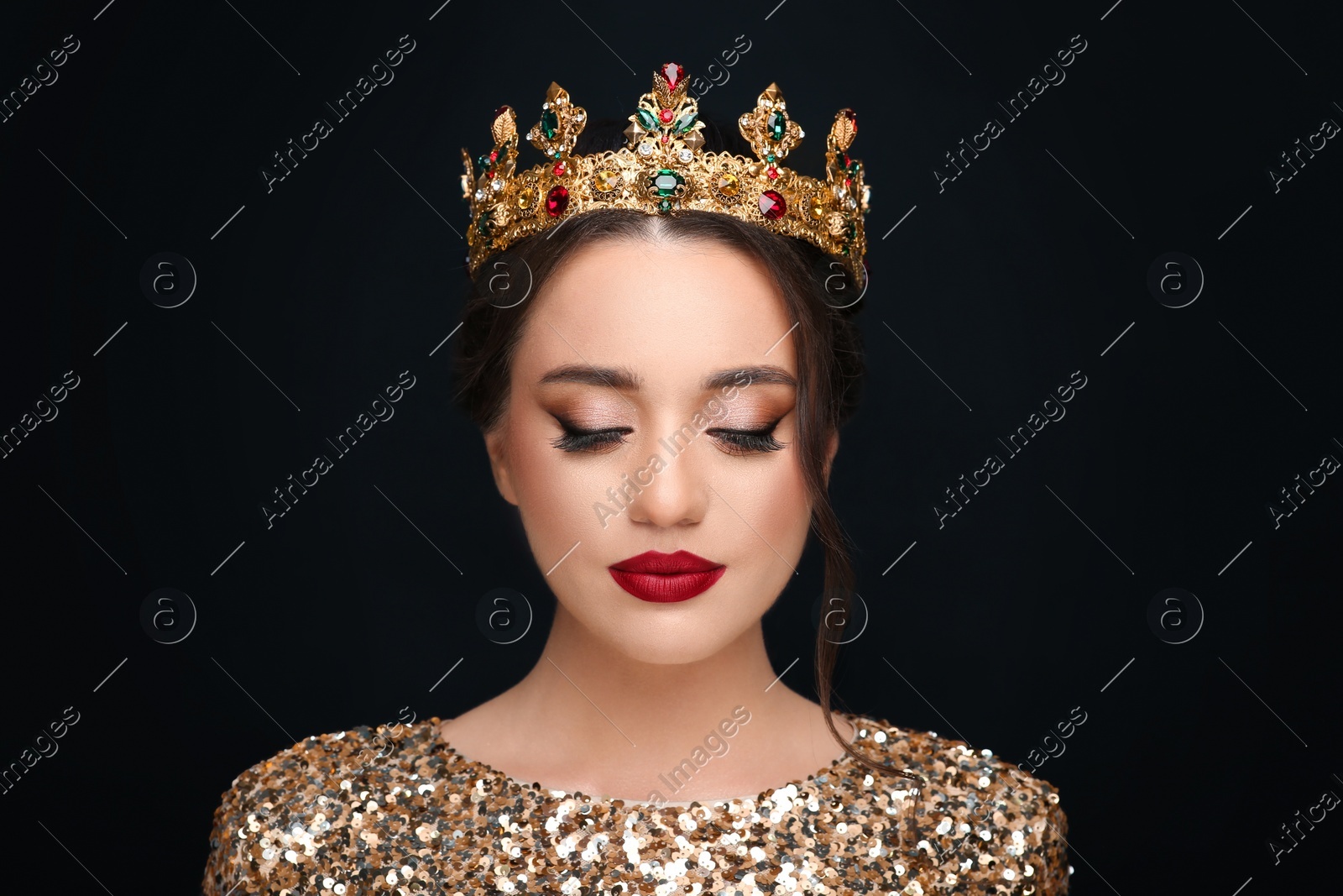Beautiful young woman wearing luxurious crown on black background Photo of Beautiful young woman wearing luxurious crown on black background