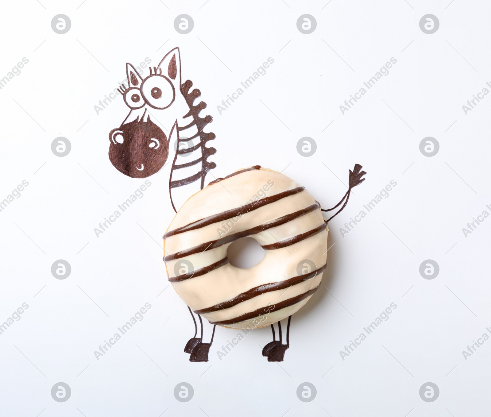 Funny zebra made with donut on white background, top view Photo of Funny zebra made with donut on white background, top view