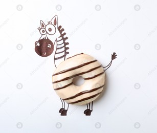Funny zebra made with donut on white background, top view Photo of Funny zebra made with donut on white background, top view