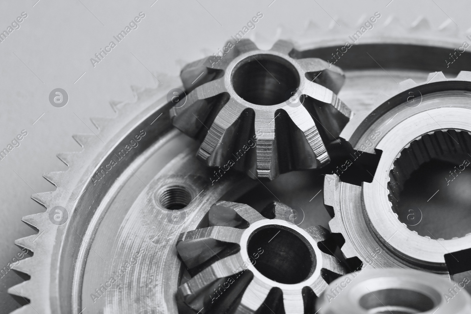 Different stainless steel gears on light grey background, top view Photo of Different stainless steel gears on light grey background, top view