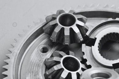 Different stainless steel gears on light grey background, top view Photo of Different stainless steel gears on light grey background, top view