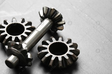 Different stainless steel gears on light grey background, closeup. Space for text Photo of Different stainless steel gears on light grey background, closeup. Space for text