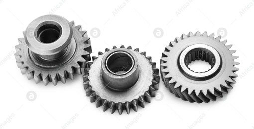 Different stainless steel gears on white background Photo of Different stainless steel gears on white background