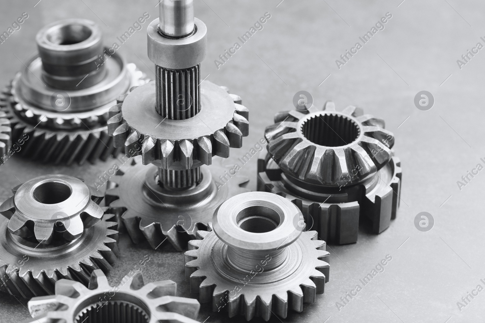 Different stainless steel gears on light grey background, closeup Photo of Different stainless steel gears on light grey background, closeup