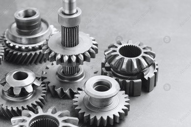 Different stainless steel gears on light grey background, closeup Photo of Different stainless steel gears on light grey background, closeup