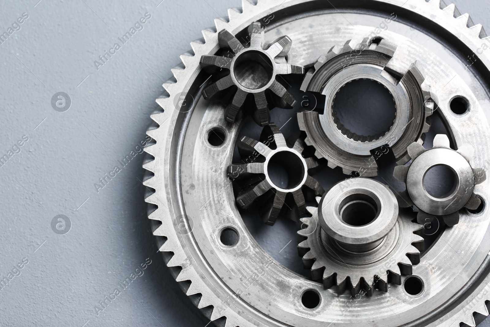 Different stainless steel gears on light grey background, top view Photo of Different stainless steel gears on light grey background, top view