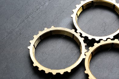 Stainless steel gears on grey background, closeup Photo of Stainless steel gears on grey background, closeup