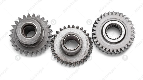 Different stainless steel gears on white background Photo of Different stainless steel gears on white background
