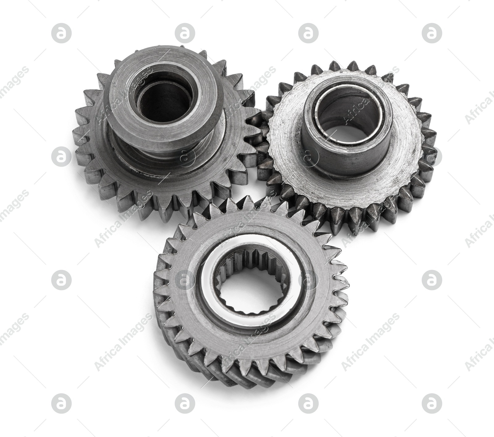 Different stainless steel gears on white background Photo of Different stainless steel gears on white background
