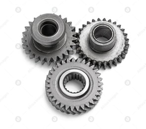 Different stainless steel gears on white background Photo of Different stainless steel gears on white background