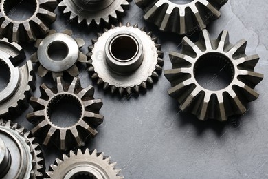Different stainless steel gears on light grey background, above view Photo of Different stainless steel gears on light grey background, above view