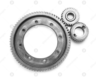 Different stainless steel gears on white background, top view Photo of Different stainless steel gears on white background, top view